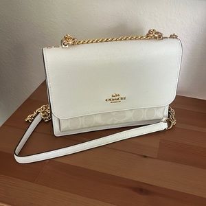 White Coach handbag with gold accents